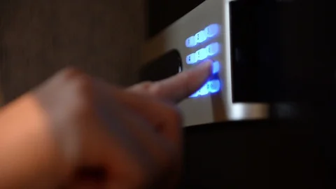Unlocking combination to safe in the hotel room Stockbeeldmateriaal 97912797