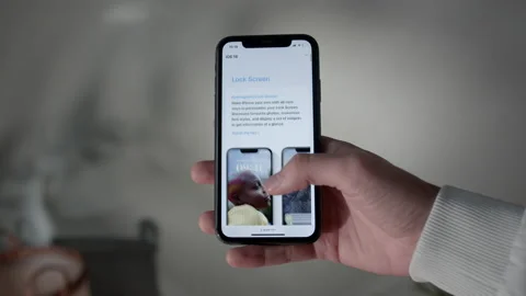 Unlocking iPhone with IOS 16 and opening safari, POV Stock Footage 217768333