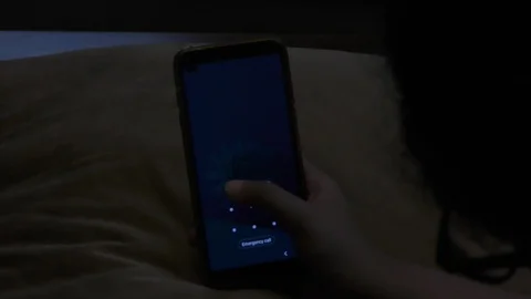 Unlocking mobile phone using fingers and entering the security code. Video stock 127017370