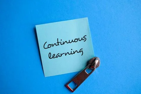 Unlocking Potential through Continuous Learning with Metal Zipper on Blue Paper Stock Photos