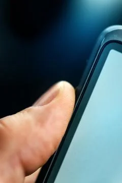 Unlocking smart phone with fingerprint sensor scan Stock Photos