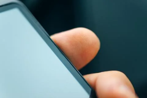 Unlocking smart phone with fingerprint sensor scan Stock Photos