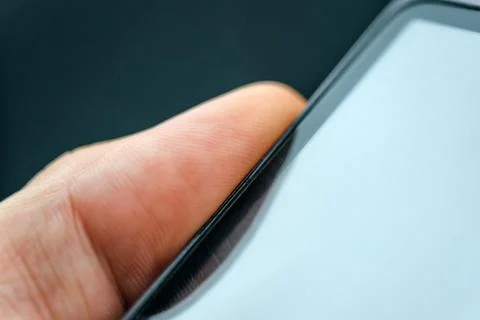 Unlocking smart phone with fingerprint sensor scan Stock Photos