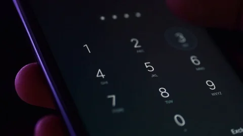 Unlocking a smartphone, typing PIN password Stock Footage 95157212