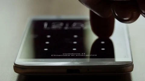 Unlocking smartphone using finger: closeup footage on display Stock Footage 74410621