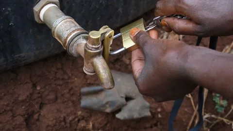 Unlocking the water tap Stock Footage 161492004