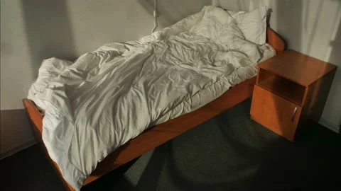 Unmade Bed in bright sunlight. Shadow of a curtain of the window. Time lapse Stock-Footage 166505045