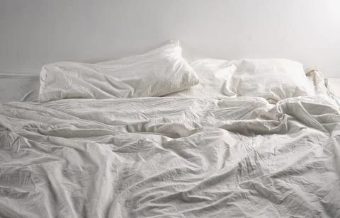 Unmade bed sheets Stock Photos