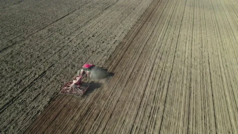 Unmanned tractor controlled remotely, working on arable land. Stock Footage 165069847