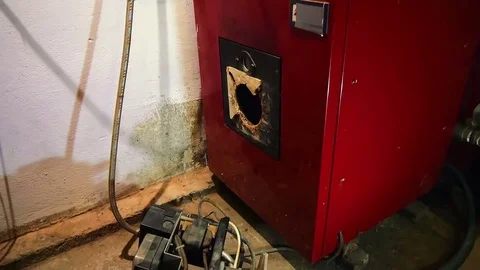 Unmounted gas burner standing in front of furnace waiting for service. Stock Footage 81808869