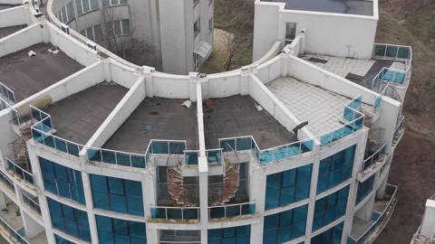 Unoccupied circular buildings standing alone in fields under cloudy sky Stock Footage 328828847