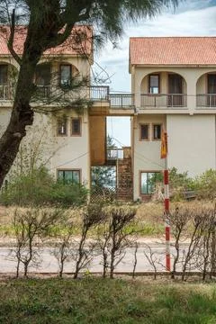 Unoccupied Multi Story Resort Complex with Orange Tile Roofing Stock Photos