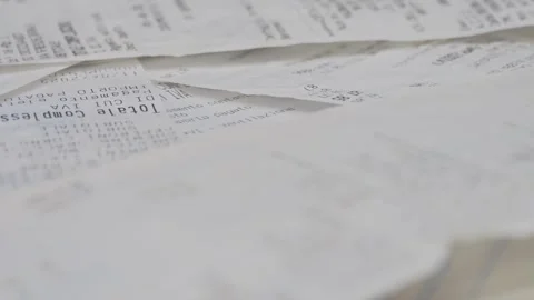 Unorganized Receipts Pile From Various Shops Collected Over a Year Stock Footage 280313943