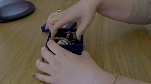 Unoxing a box of bracelets Stock Footage 329710662