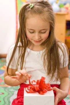 Unpackign the gift Stock Photos