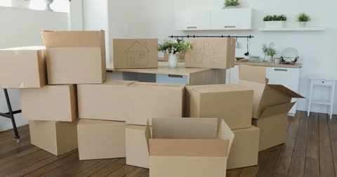 Unpacking Boxes In New Home On Moving Day. Moving to a new home concept Vídeo Stock 76138243