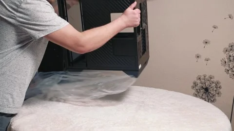 Unpacking computer case before starting personal computer assembly Stock Footage 332182538