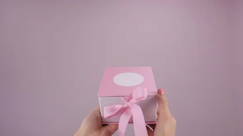 Unpacking empty present box. Female hands holding and opening gift Stock Footage 123163065