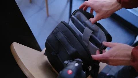 Unpacking a Laptop from a Backpack Stock Footage 278913774