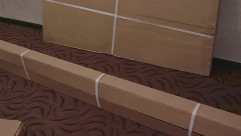 Unpacking a large boxes moving new room furniture assembly Stock Footage 148747329