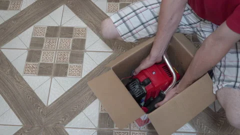 Unpacking the mower Stock Footage 208935894