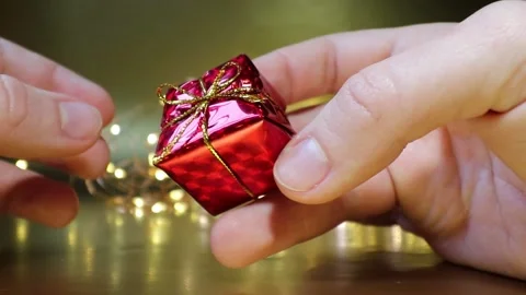 Unpacking a New Year's gift. Stock Footage 164969601