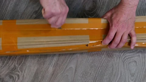 Unpacking a paper box parcel. 動画素材 168930180