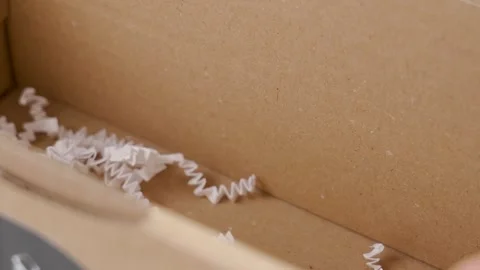 Unpacking a postal parcel with a white protective filler Video stock 241800920