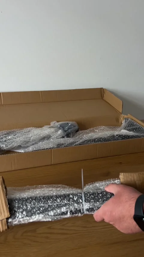 Unpacking Pull-Up Bar Components with Knife Stock Footage 311017533