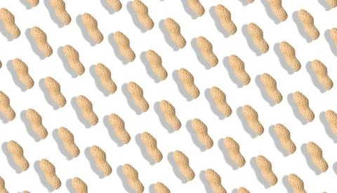 Unpeeled peanuts on white background. Pattern, banner design Stock Photos