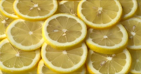 Unpeeled, sliced lemons background. Video stock 301646078