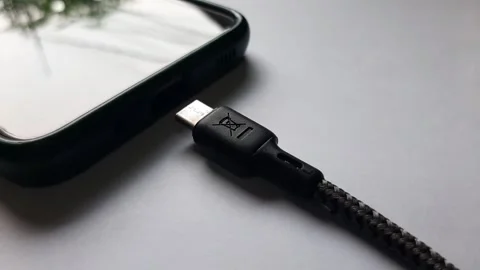 Unplug the charging cable from the phone Stock Footage 284442273