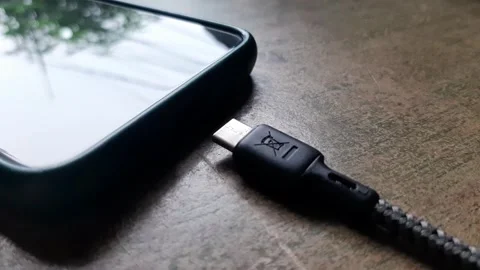 Unplug the charging cable from the phone Stock Footage 284442292