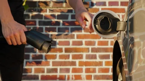 Unplug connector EV car Stock Footage 258980255