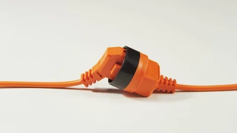 Unplugging and Plugging Cable to an Extension Cord Stock Footage 70999492