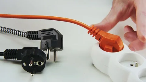 Unplugging and Plugging Orange Cable Stock Footage 69711347