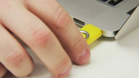Unplugging and Plugging a Yellow Pen Drive Stock Footage 70993639