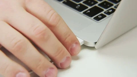 Unplugging Black Cable From a Computer Stock Footage 70989979