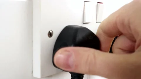 Unplugging A British Plug From The Socket Stock Footage 134728933