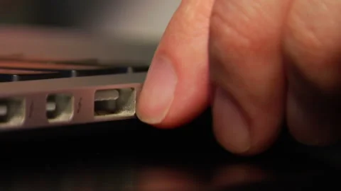 Unplugging Headphones from laptop Stock Footage 144421171
