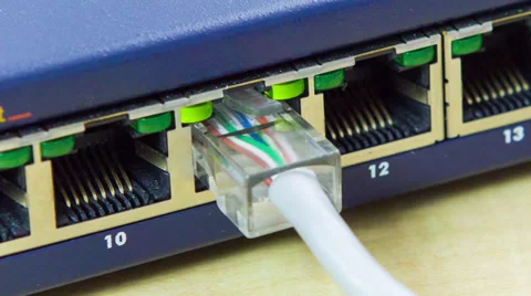 Unplugging a network cable from network router Stock Footage 32243070