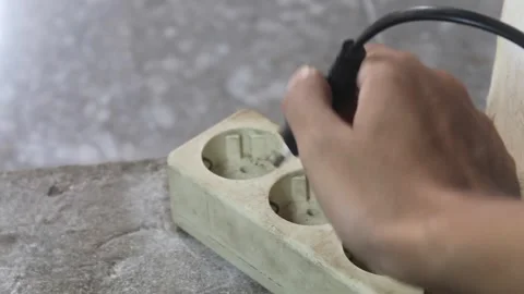 Unplugging Power Cord From Electrical Outlet Stock Footage 345495289