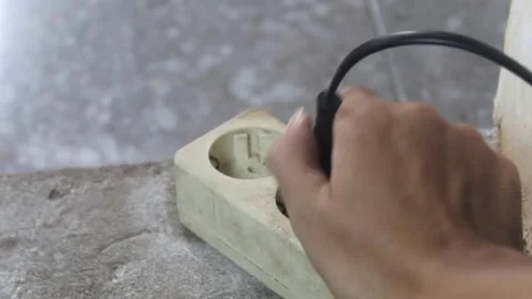 Unplugging Power Cord From Electrical Outlet Stock Footage 345495398