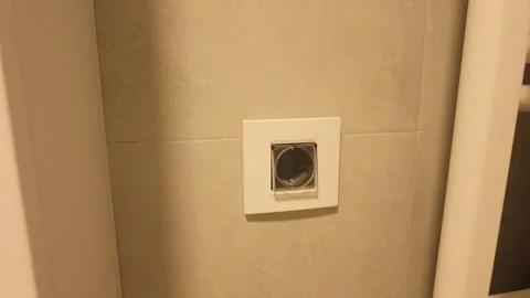 Unplugging power cord from wall socket Stock Footage 318106399