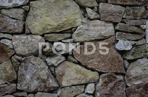 Unpolished marble stone wall Stock Photos