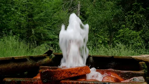 Unprocessed thermal water breaking through the ground Stock Footage 109525847