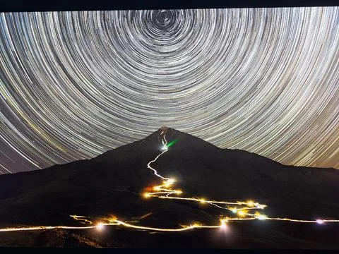 Unreal mountain view with stars in the sky Stock Photos