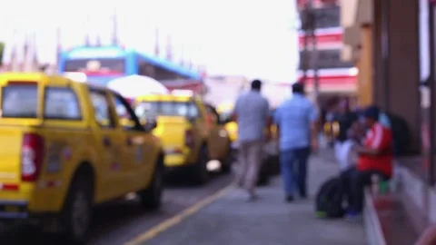 A unrecognisable crowd of people from the back alongside taxis Stock Footage 153721067