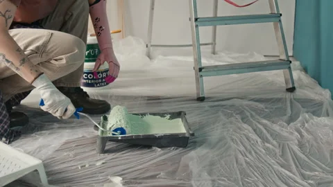 Unrecognisable Girl with Bionic Arm Using Roller Brush to Apply Paint 스톡 동영상 323310889