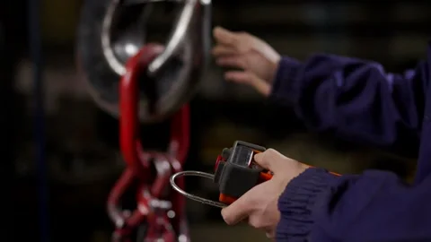 Unrecognisable person using remote control to move a crane Stock Footage 267044831